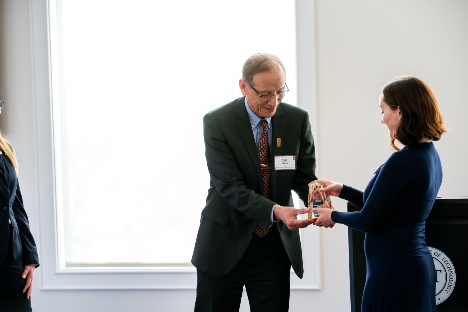Olivia Svrchek receiving the RIT Emerging Leader Award from the Dean